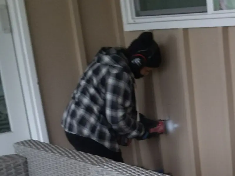 Professional electrician installing an exterior outlet in Springfield